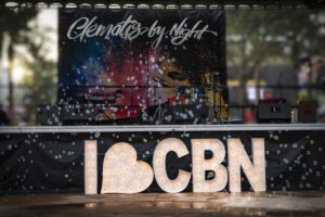 A sign that says i love cbn with lights on it.