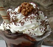 A close up of some whipped cream and nuts