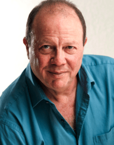 A man in blue shirt and white background