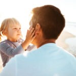 lovely daughter kiss the dad